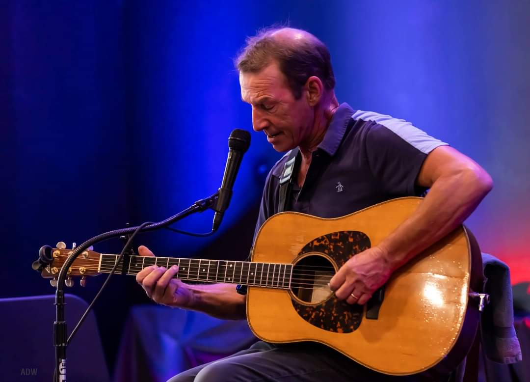 John Dady playing the guitar